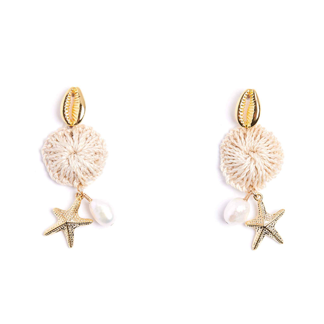 Pair of earrings with starfish and shell designs on a white background