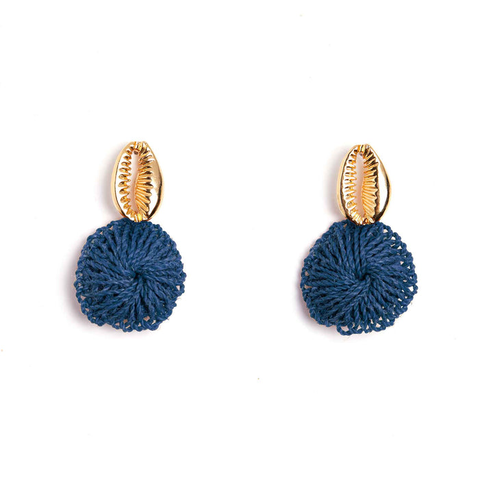 Pair of blue knotted earrings with gold shell-like tops on a white background
