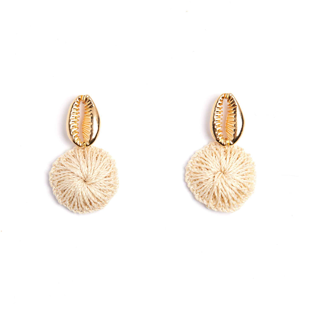 Pair of gold and beige earrings on a white background