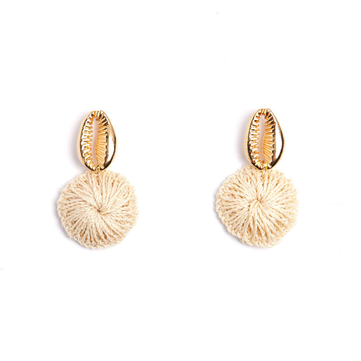 Pair of gold and beige earrings on a white background