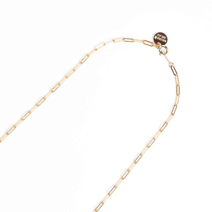 Gold chain necklace on a white background