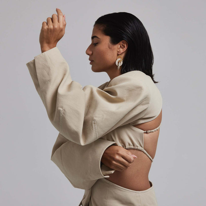 Model wearing bilum and bilas kinship double hoop earrings