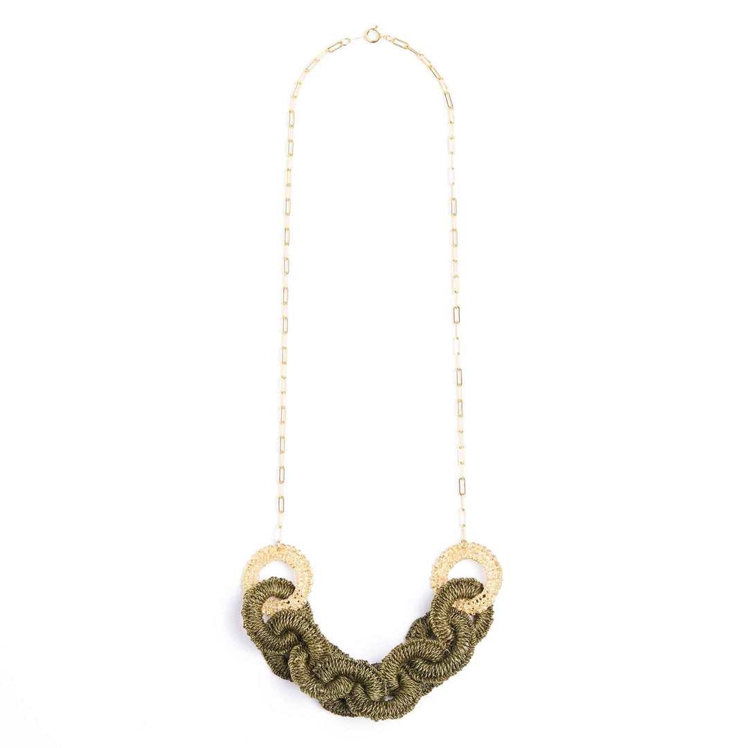 Necklace with green braided design and gold accents on a white background