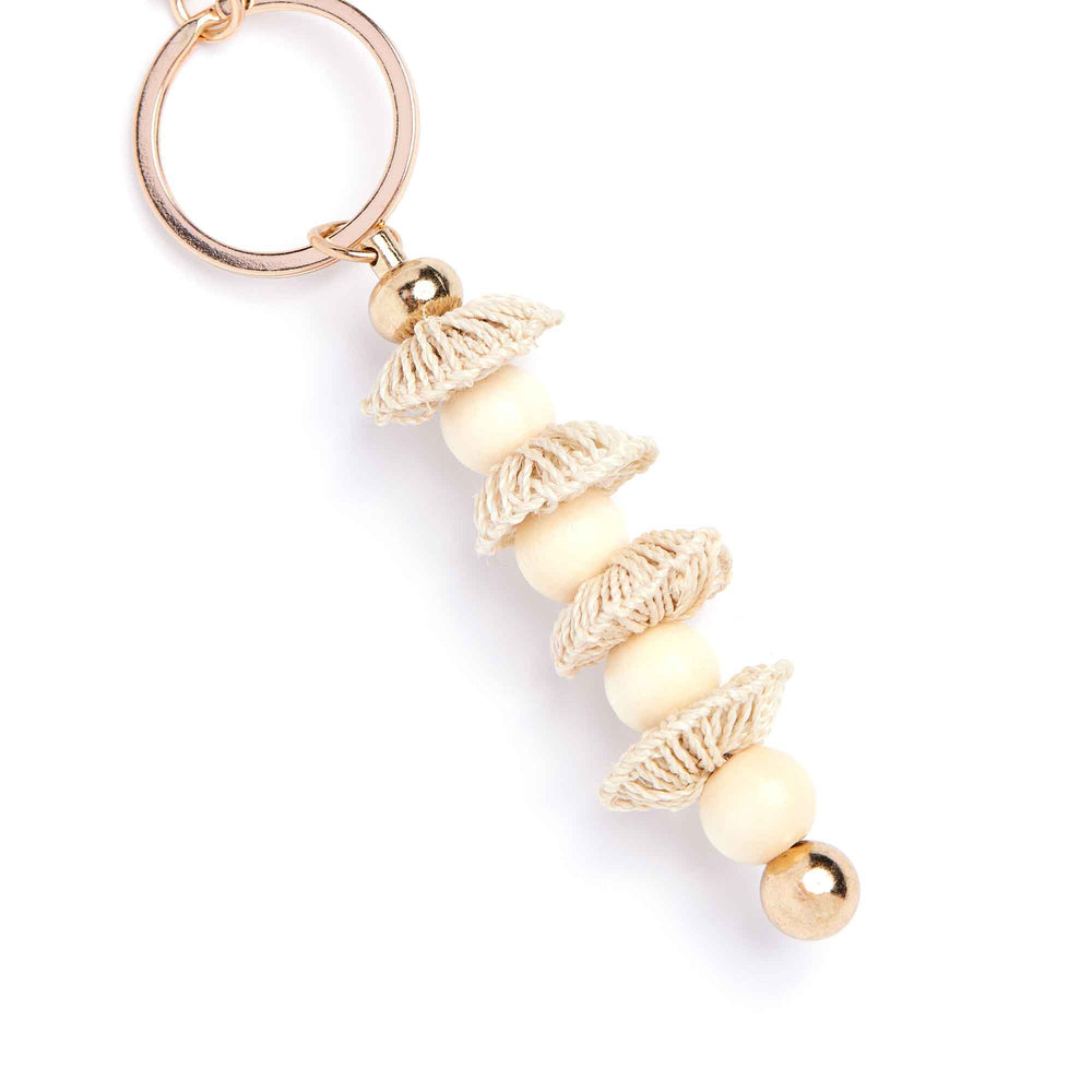 Keychain with leaf-shaped beads on a white background