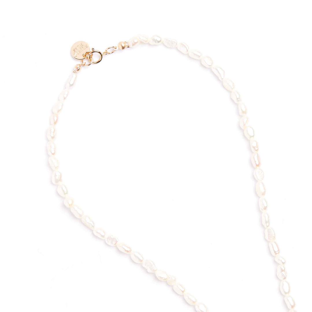Pearl necklace with a gold clasp on a white background