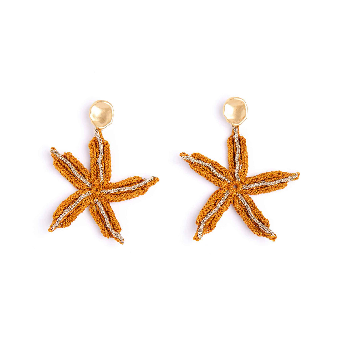 Starfish-shaped earrings with gold accents on a white background