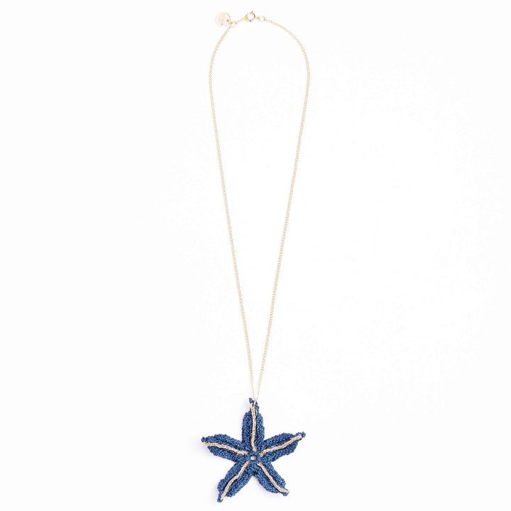 Starfish-shaped pendant necklace on a white background