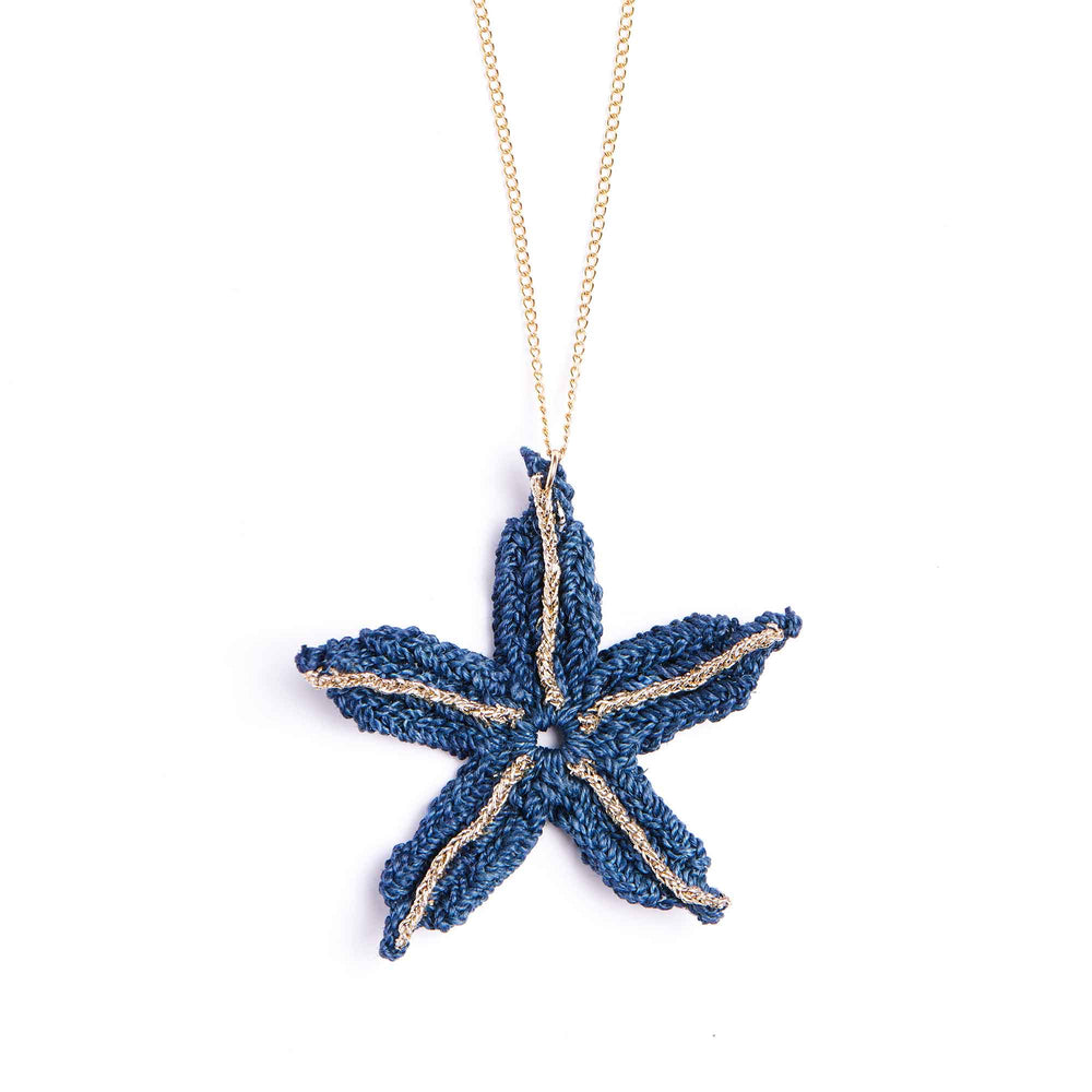 Blue starfish pendant on a gold chain against a white background