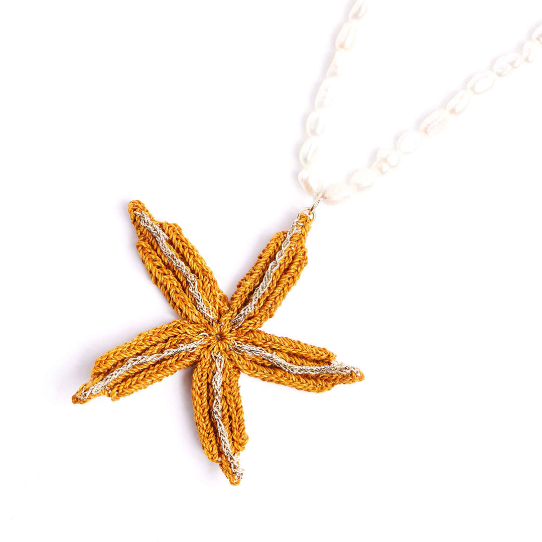 Knitted starfish ornament on a white background