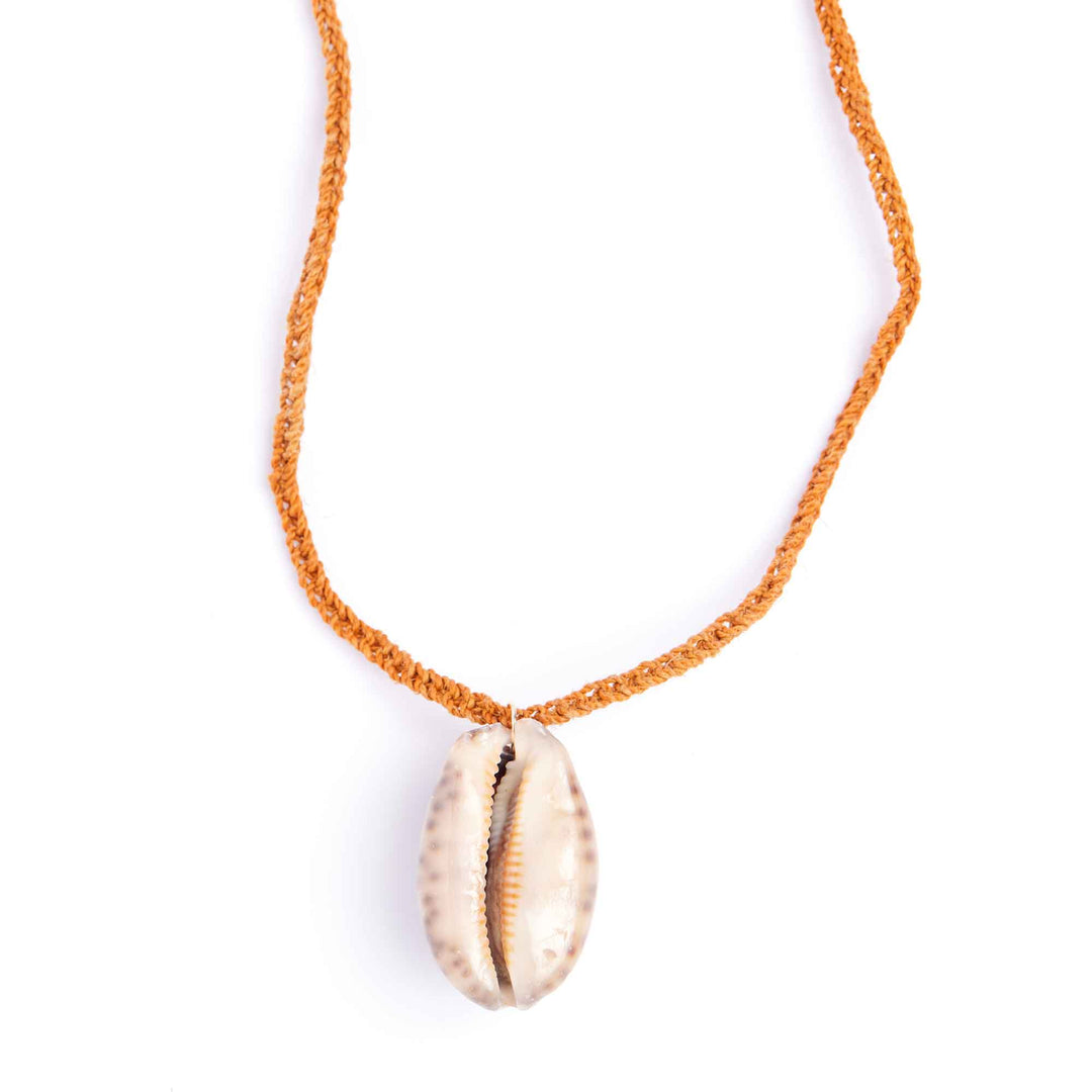 Necklace with a shell pendant on an orange cord against a white background