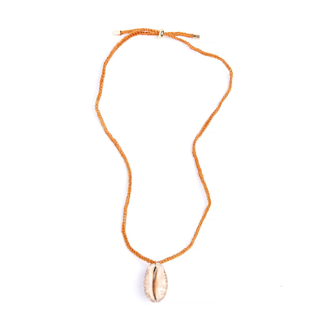 Necklace with a shell pendant on an orange cord against a white background