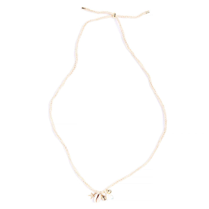 Gold necklace with a small pendant on a white background