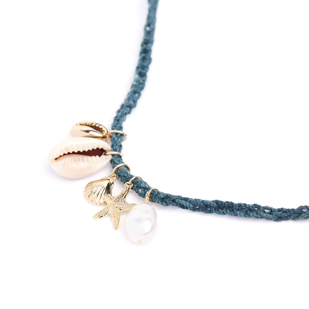 Bracelet with shell and starfish charms on a white background