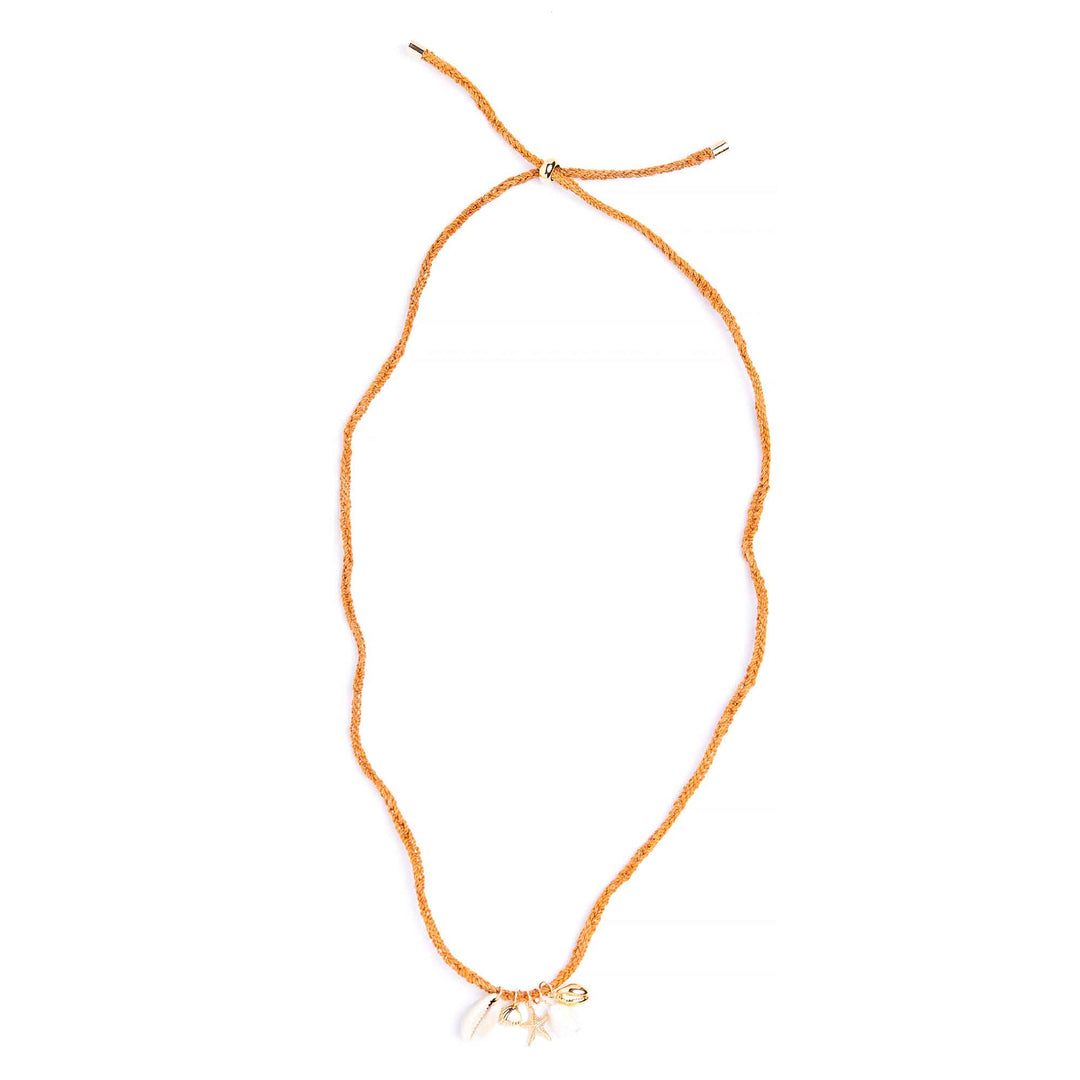 Orange beaded necklace with a starfish charm on a white background