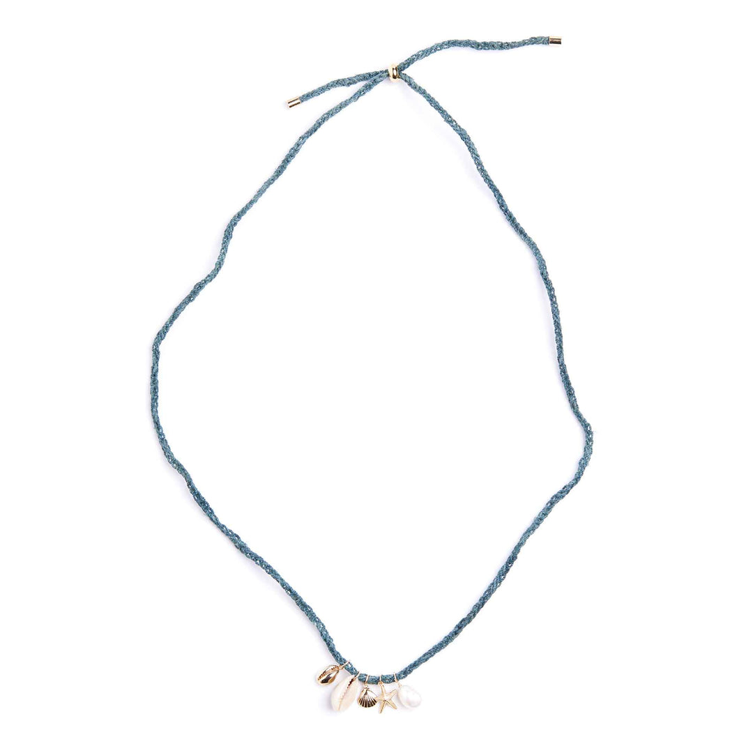 Blue string necklace with small charms on a white background