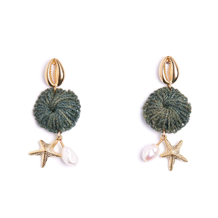 Pair of earrings with green knotted charms, starfish, and pearls on a white background