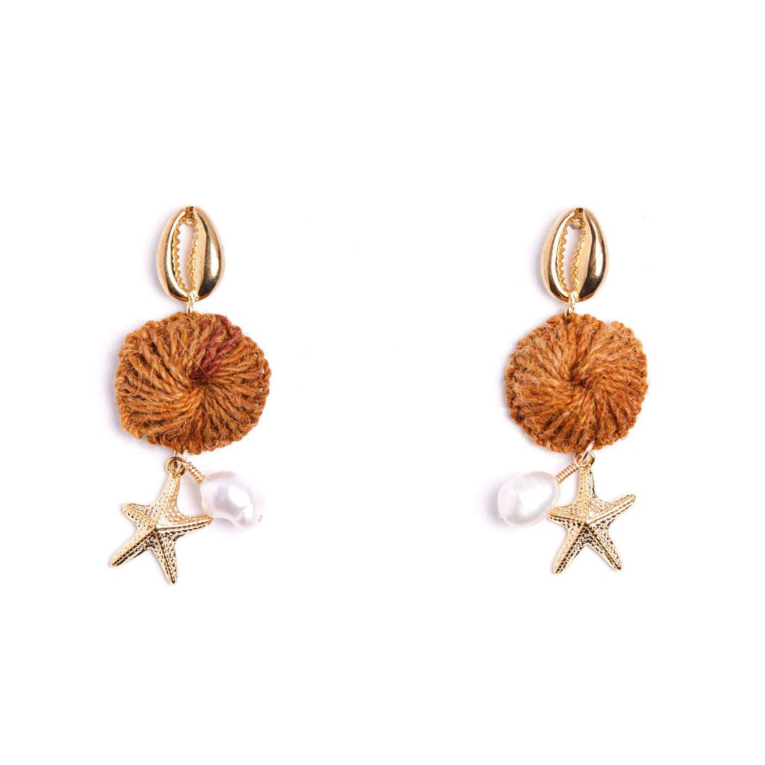 Pair of earrings with brown spherical elements, starfish, and pearls on a white background