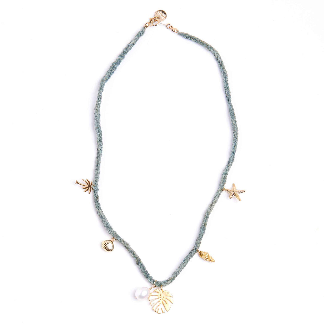 Necklace with starfish, shell, and pearl charms on a white background