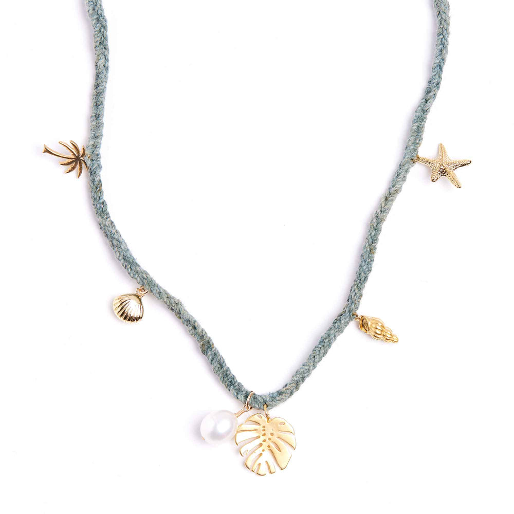 Necklace with gold and silver charms on a white background