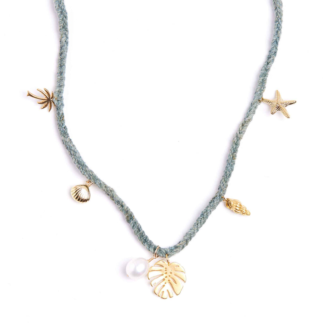 Necklace with gold and silver charms on a white background