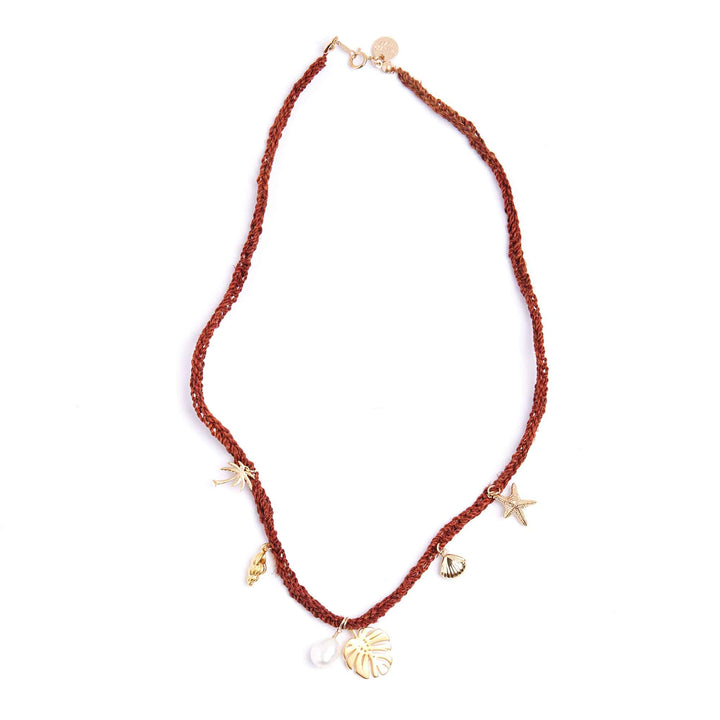 Necklace with gold charms on a white background