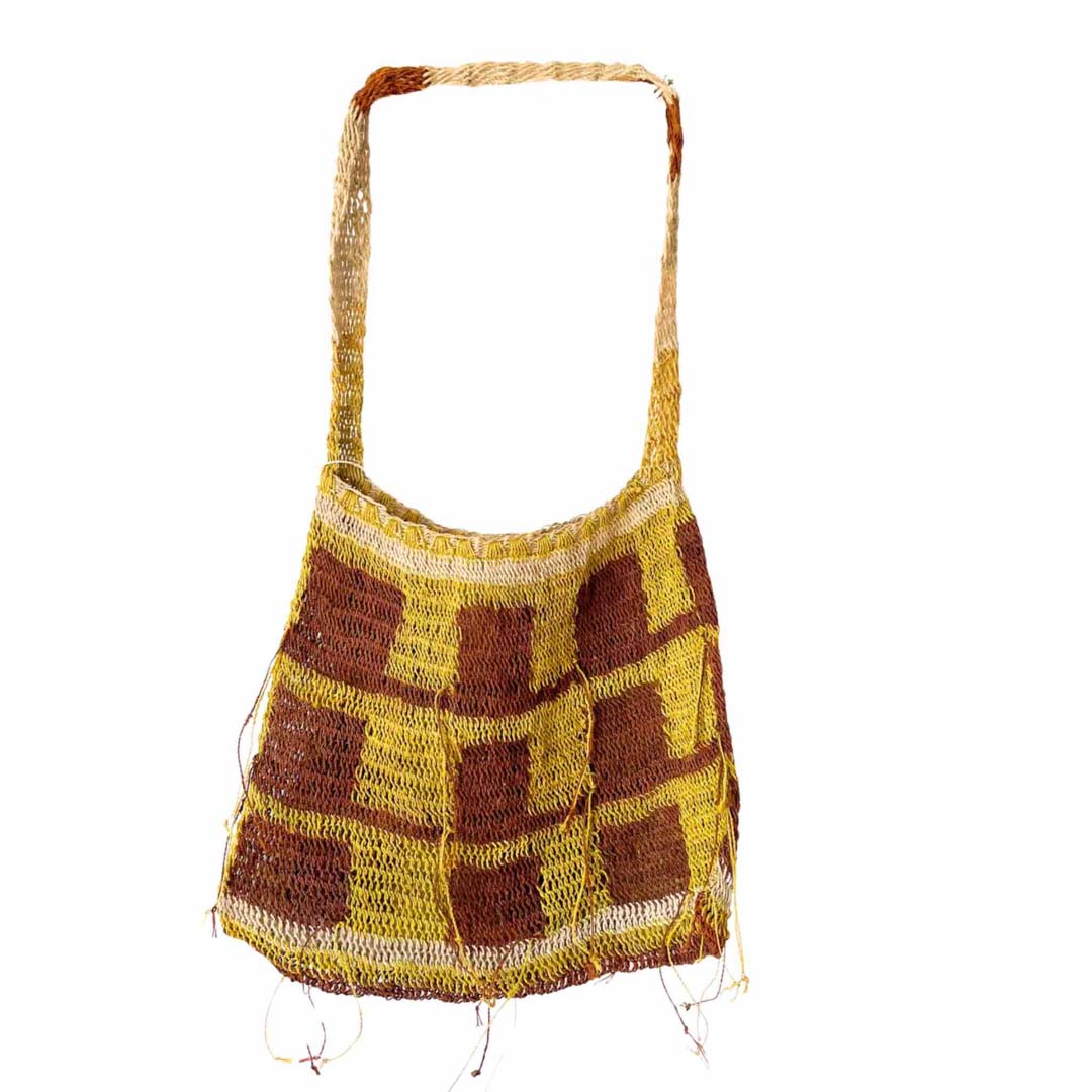 Brown and yellow thick weave bilum hanging on display.
