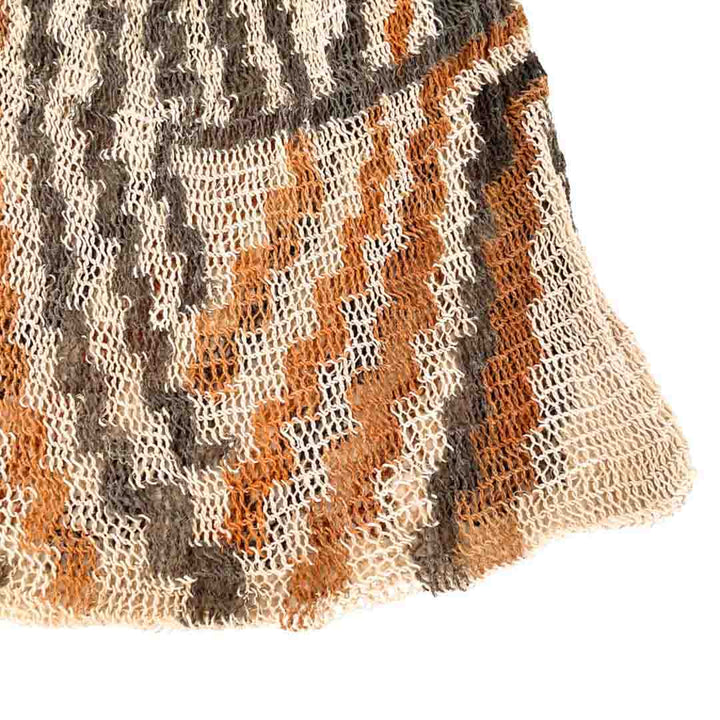 Corner close up on the weave of a multicoloured bilum.