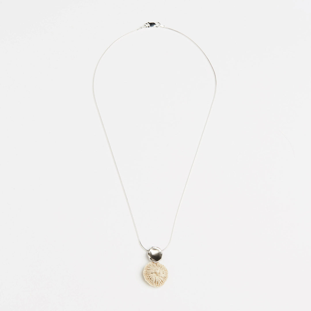 Full view of Bilum and Bilas sterling silver chain necklace with an ethical handwoven natural fibre pendant