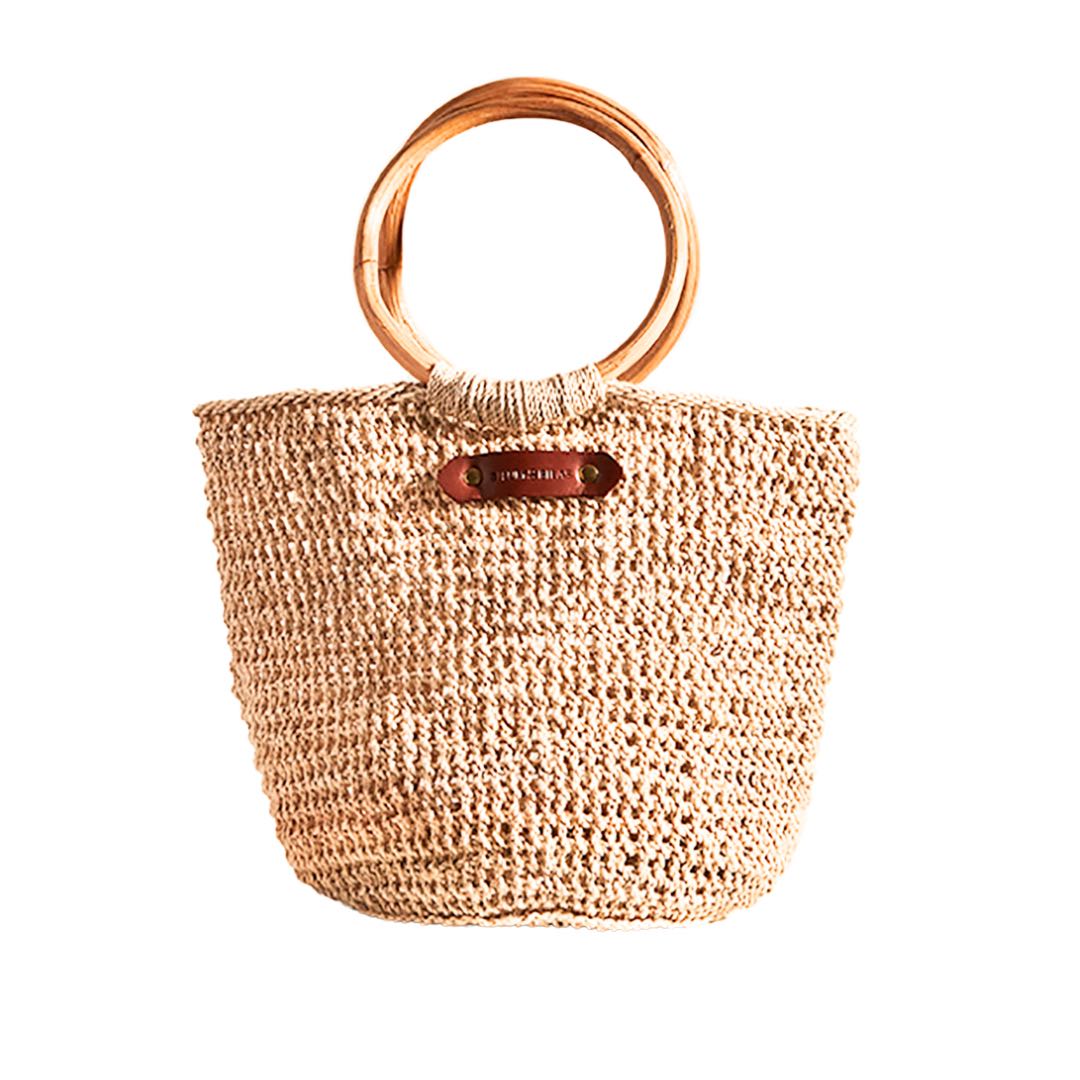 Handwoven basket with natural round dance handles on a white background