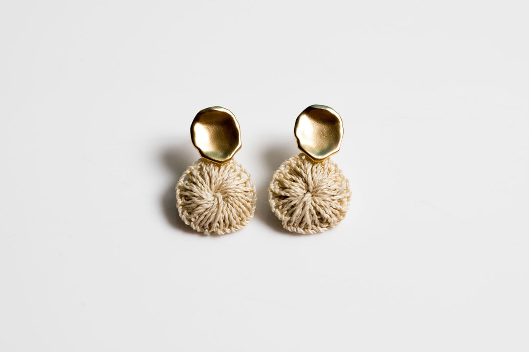 Wide view of gold maki natural fibre earrings