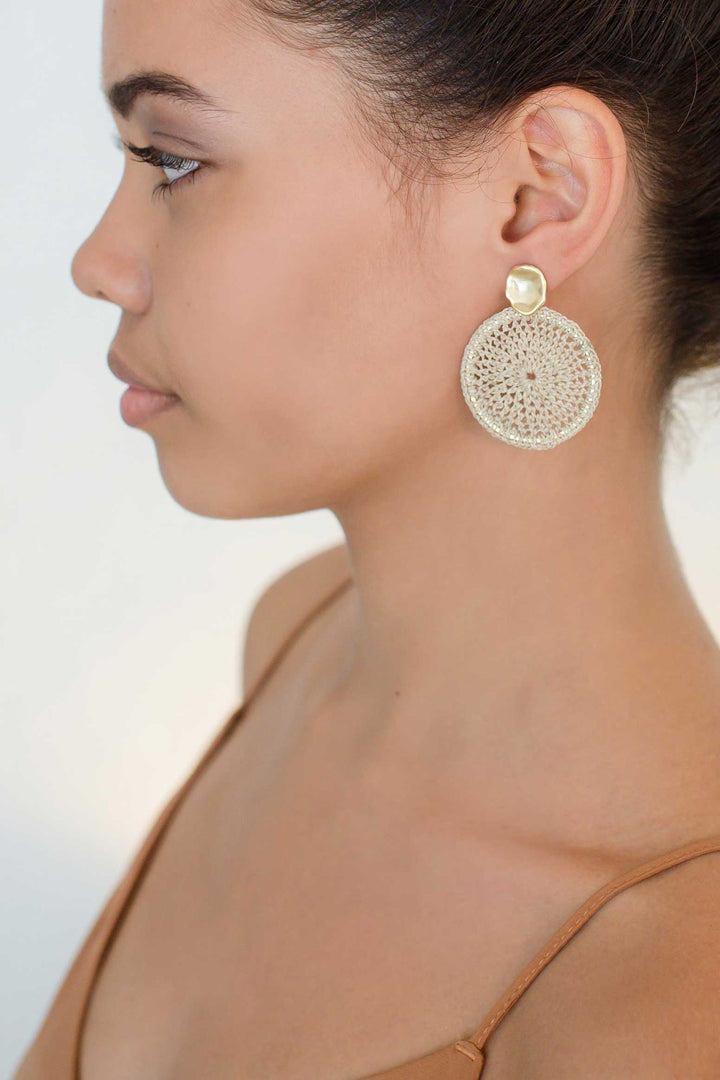 Model wearing Bilum and Bilas sowana disc earrings - Crochet woven disc earrings with gold ear post