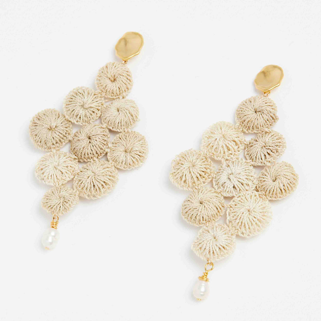 Gold and pearl with woven natural fibre statement Malalo Chandelier earrings angle view