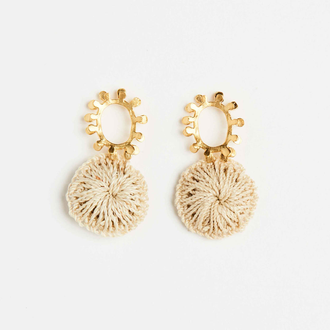 Gold textured sun earrings with natural fibre woven discs front view