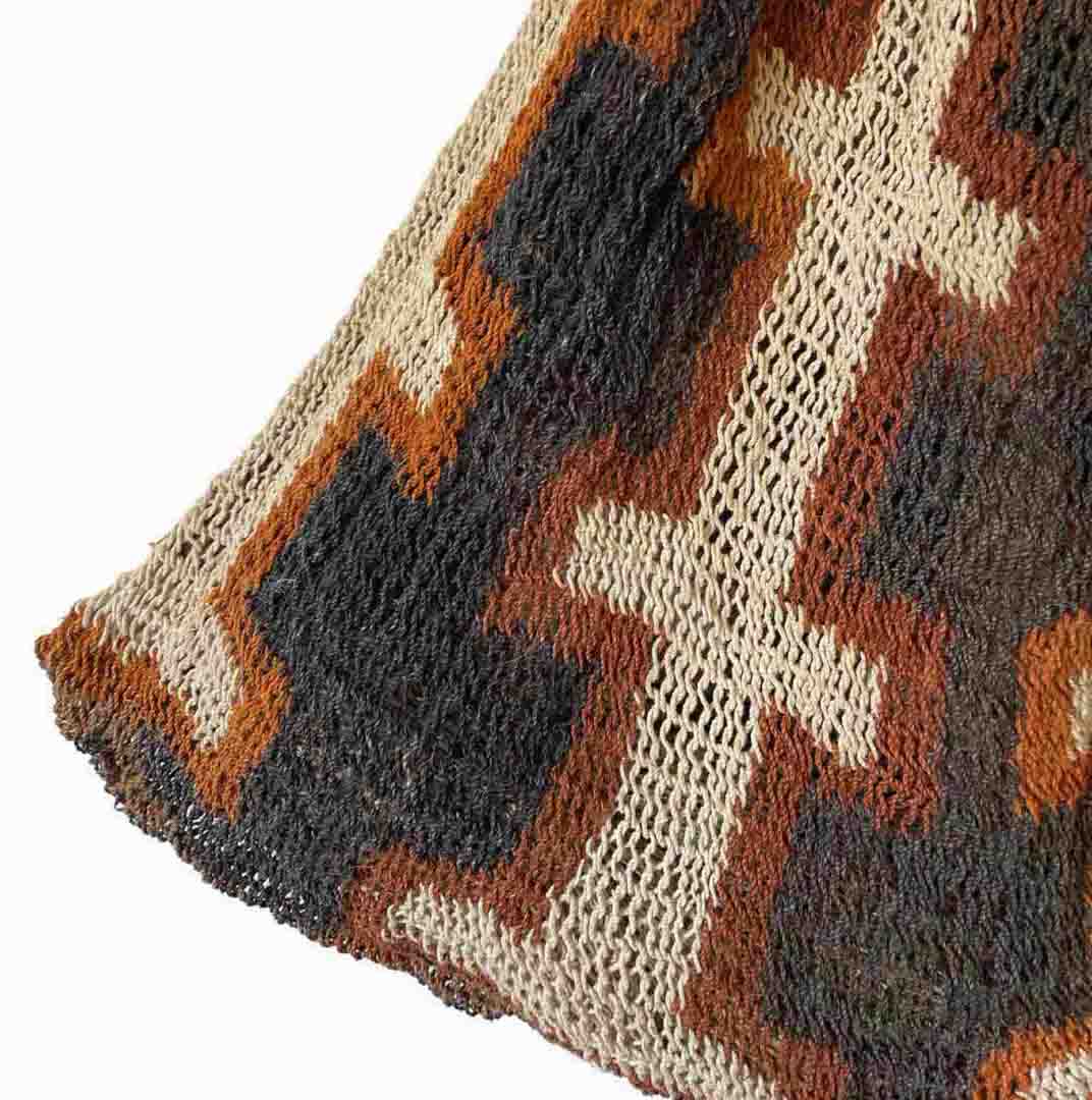 Corner of square pattern black and orange bilum from Keram Village.