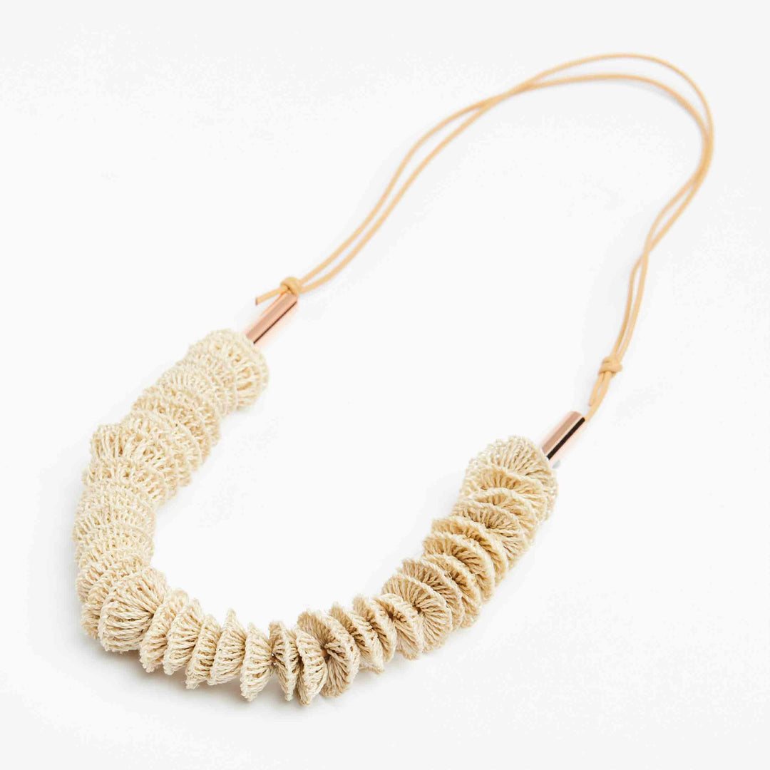 Bilum and Bilas Textile jewellery necklace with stacked woven beads on leather necklace. Bilum and Bilas