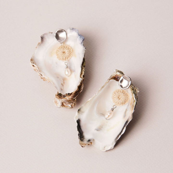 Lik Lik Malalo Earrings with pearl and natural fibre still life with oyster shells