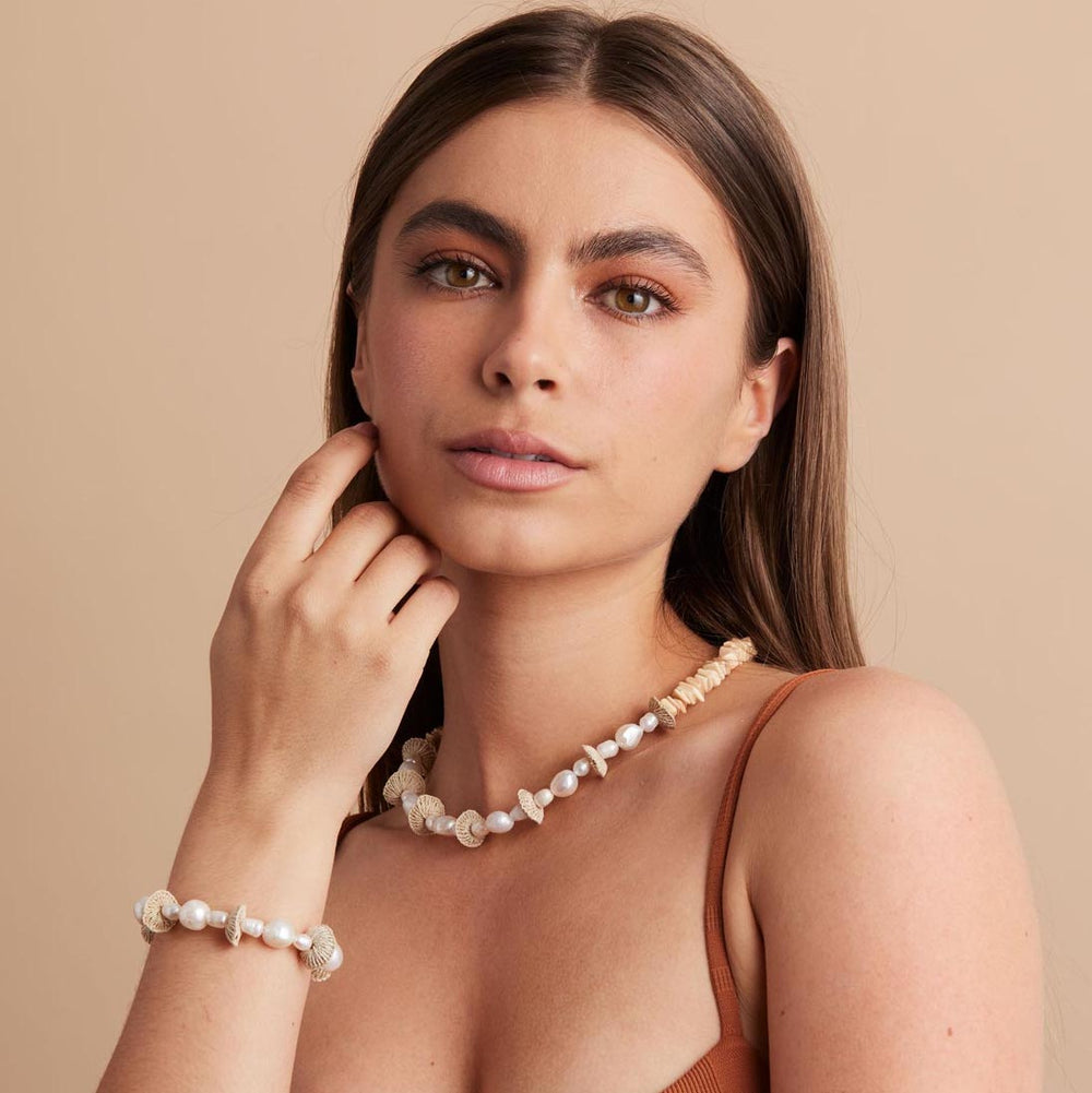 Model posing in pearl stack bracelet