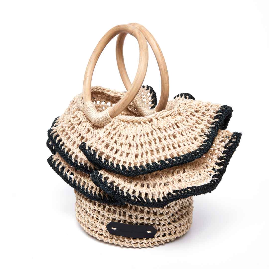 Side angle of the Black Ripple basket with woven ruffles with black trims.