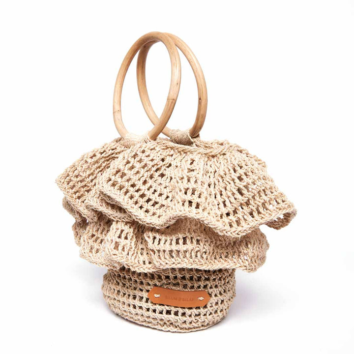 Side view of the natural ripple basket with woven ruffle trims.