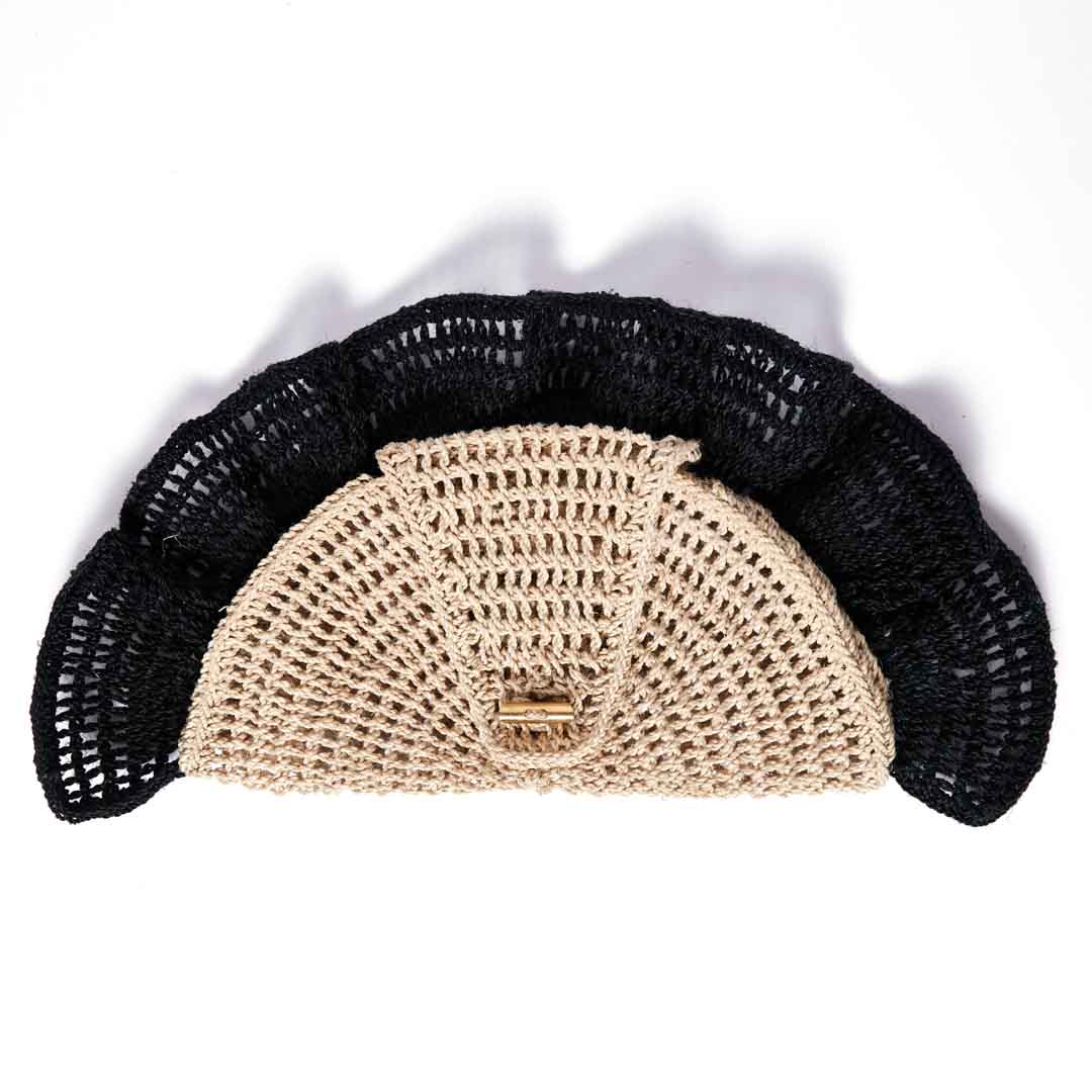 Back side of the Ripple Clutch in black woven bag.