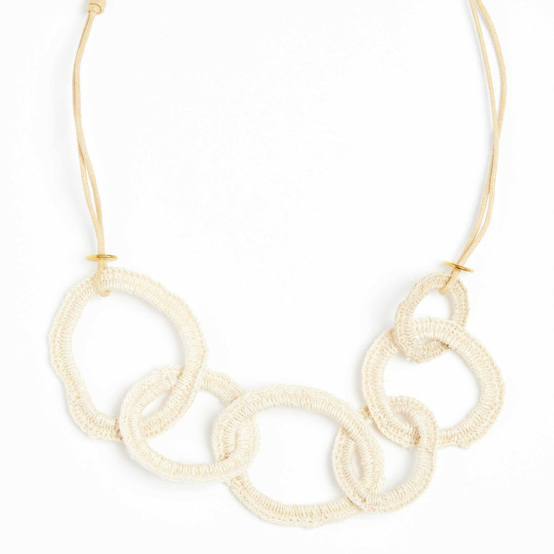 Front of woven chain necklace on a side angle.