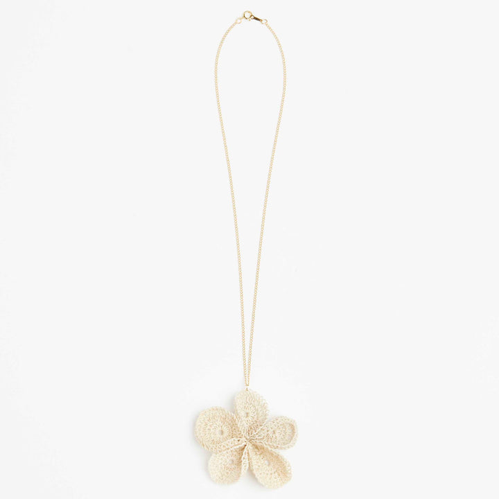 Gold and natural woven flower pendant necklace.