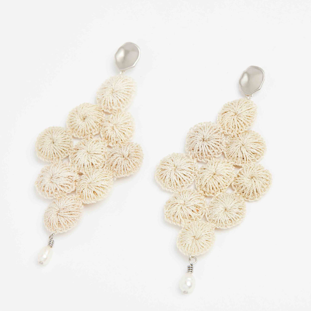 Silver and pearl with woven natural fibre statement Malalo Chandelier earrings angle view