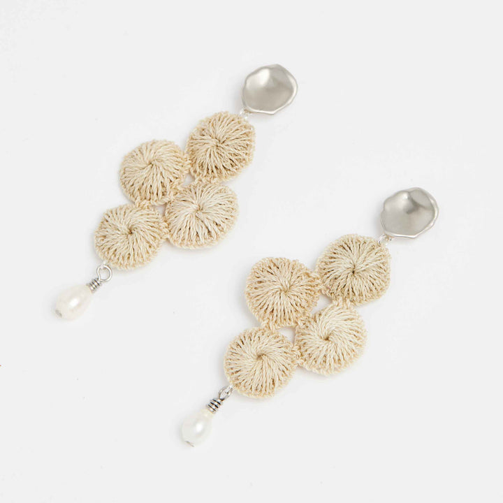 Silver Malalo Breeze earrings with pearl and natural fibre angle view