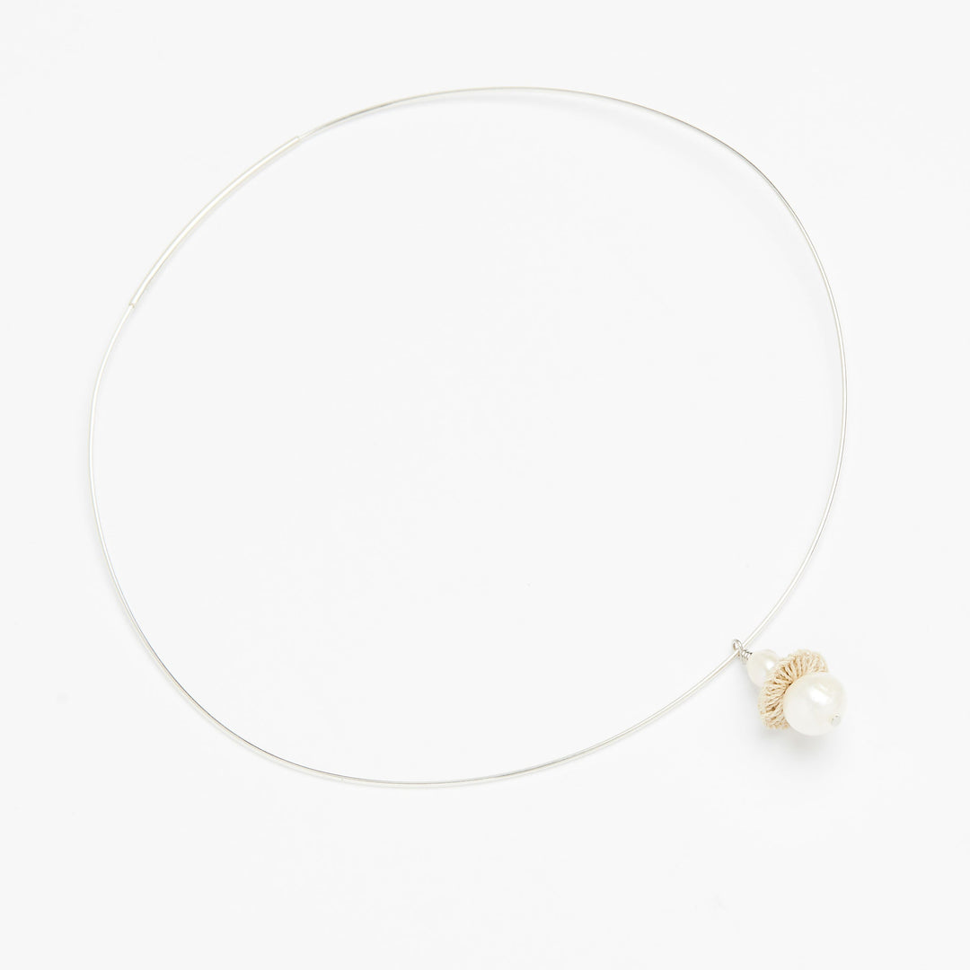 Full view of sterling silver choker with pearl and woven natural fibre disc #Silver